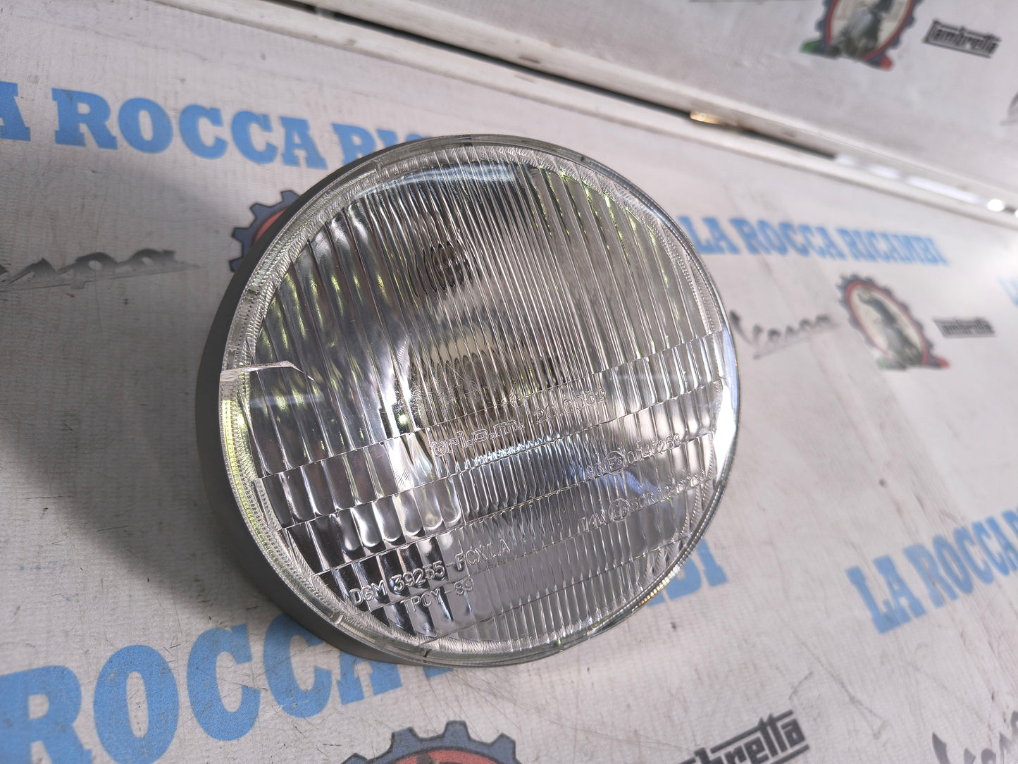 Faro anteriore TRIOM Vespa HP / V (Ha una piccola crepa)