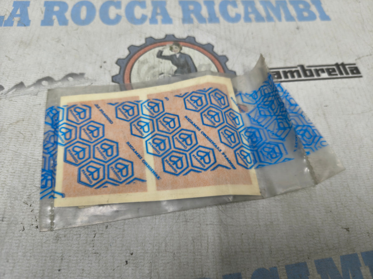 TARGHETTA ADESIVA MASCHERINA PORTAFARO ORIGINALE PIAGGIO SUPERBRAVO 50 226218
